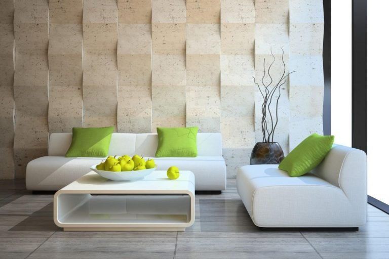 Bộ ghế sofa gam màu trắng cùng với những chiếc gối xanh tạo điểm nhấn hoàn hảo cho tổng thể không gian