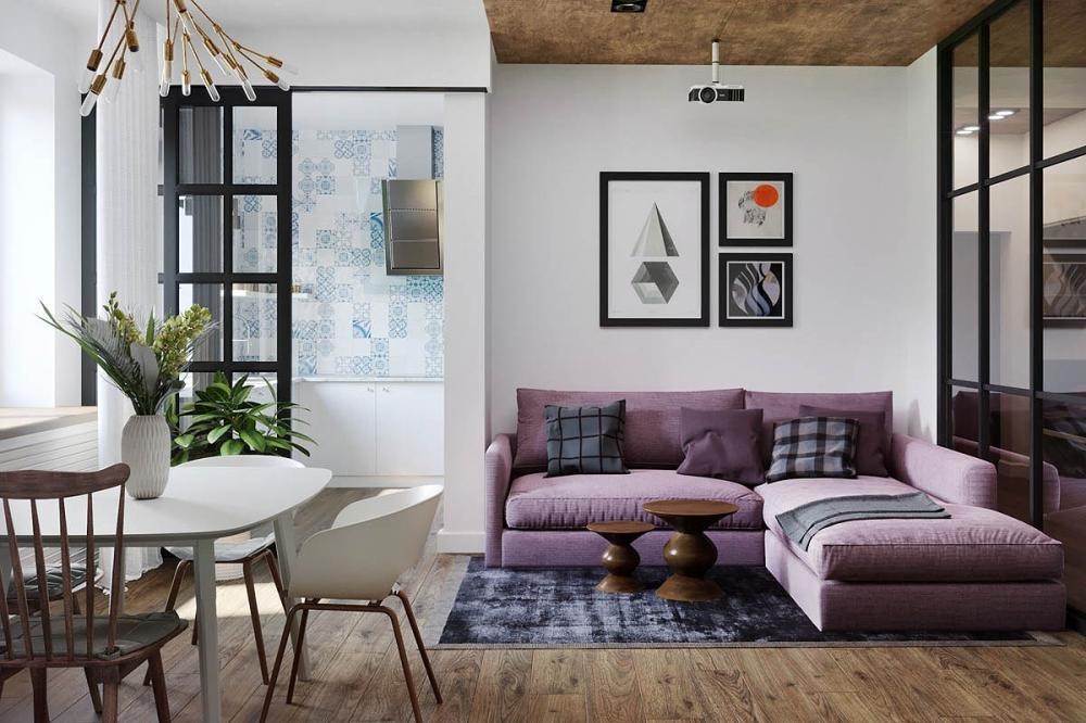 Bộ sofa êm ái màu tím là điểm nhấn cho căn phòng khách lấy tone trắng làm chủ đạo