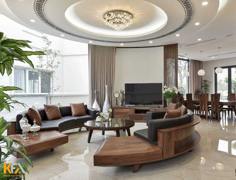 Phòng khách thiết kế cách điệu với đèn trần và bộ bàn ghế gỗ óc chó cao cấp