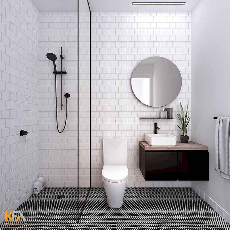 Nọi thất phòng tắm nhỏ gọn, có vách ngăn kính giữa phòng tắm và nhà vệ sinh