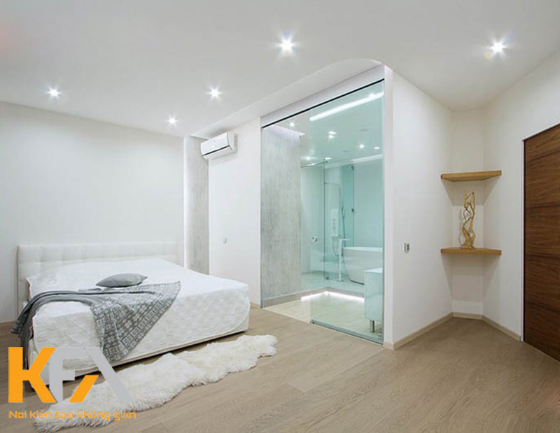 Căn phòng ngủ diện tích 25m2 với nội thất tối giản kết hợp nhà vệ sinh trong phòng